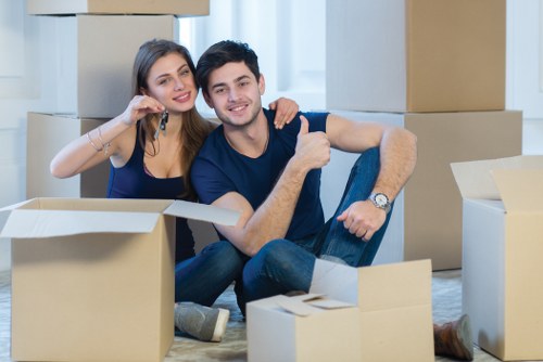 Professional movers loading office items for relocation in Kentishtown