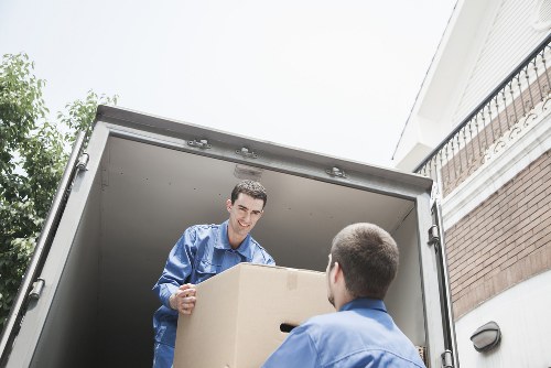 A removals team navigating stairs and narrow access in Kentishtown