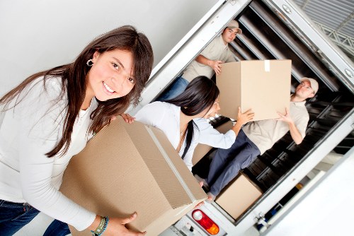 Packed household boxes and furniture ready for storage